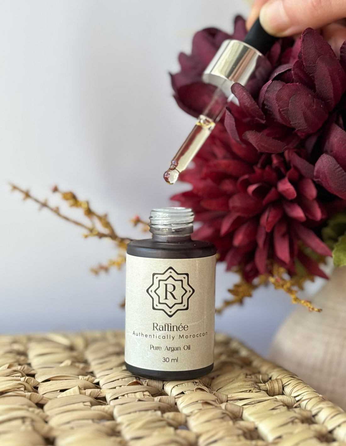 Dropper bottle of argan oil for anti-aging skincare